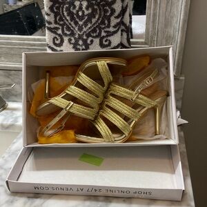Gold sandal with high heel worn once